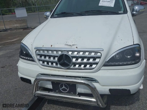 1999 Mercedes-Benz M-Class with VIN 4JGAB54E9XA089245, listed as a IAAI auction lot 41634831 with NaN miles. Bid and sale history available at carsss.com. Image 6.