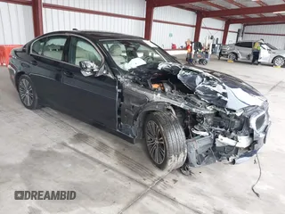 2019 BMW 5 Series 530e iPerformance with VIN WBAJA9C50KB254535, listed as a IAAI auction lot 41094049 with 57,874 mi miles. Bid and sale history available at carsss.com. Image 1.