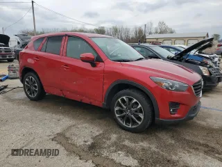 2016 Mazda CX-5 Grand Touring with VIN JM3KE4DY5G0660201, listed as a Copart auction lot 52165205 with 108,231 mi miles and Salvage Title. Bid and sale history available at DreamBid. Image 4.