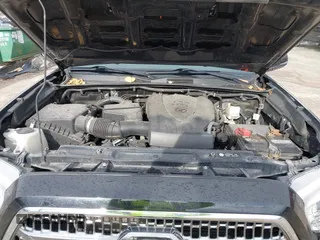2016 Toyota Tacoma SR with VIN 3TMCZ5AN2GM027945, listed as a IAAI auction lot 41446277 with 51,781 mi miles and . Bid and sale history available at DreamBid. Image 10.