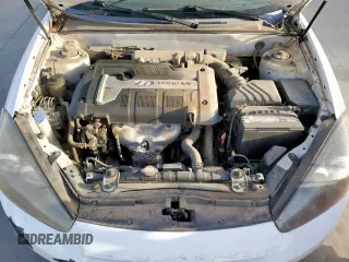 2007 Hyundai Tiburon GS z VIN KMHHM66D27U260421, wystawiony jako Copart lot #48982505 z przebiegiem 100 045 mil mil oraz Tytuł czysty. Historia ofert i sprzedaży dostępna na DreamBid. Obrazek 11.