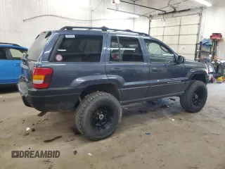 2004 Jeep Grand Cherokee Laredo with VIN 1J4GW48S24C294185, listed as a Copart auction lot 53357945 with 209,169 mi miles and Clean Title. Bid and sale history available at carsss.com. Image 3.