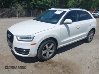 2015 Audi Q3 Premium Plus z VIN WA1EFCFS7FR012210, wystawiony jako IAAI lot #42771683 z przebiegiem 229 799 mil mil oraz . Historia ofert i sprzedaży dostępna na DreamBid. Obrazek 2.