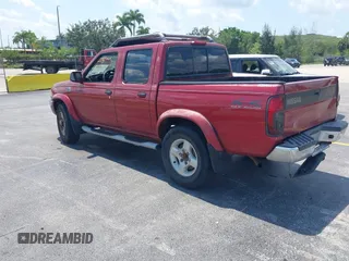 2000 Nissan Frontier XE z VIN 1N6ED27Y3YC382842, wystawiony jako IAAI lot #42343459 z przebiegiem 172 454 mil mil oraz . Historia ofert i sprzedaży dostępna na DreamBid. Obrazek 3.