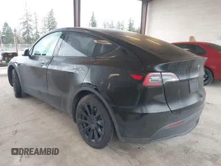2023 Tesla Model Y Long Range with VIN 7SAYGAEEXPF707503, listed as a IAAI auction lot 41712166 with 27,467 mi miles and . Bid and sale history available at carsss.com. Image 3.
