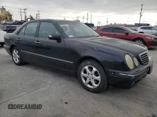2002 Mercedes-Benz E-Class with VIN WDBJF65J42B486633, listed as a Copart auction lot 76979054 with 151,429 mi miles and Salvage Title. Bid and sale history available at carsss.com. Image 4.