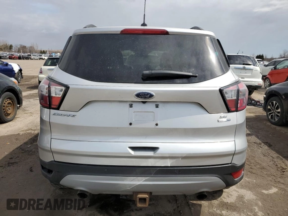 2017 Ford Escape SE with VIN 1FMCU9G94HUD89140, listed as a Copart auction lot 51699525 with 243,788 mi miles and Salvage Title. Bid and sale history available at carsss.com. Image 6.