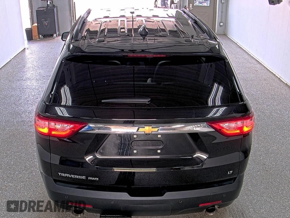 2021 Chevrolet Traverse LT with VIN 1GNEVHKW3MJ197972, listed as a IAAI auction lot 42791405 with 75,960 mi miles and . Bid and sale history available at DreamBid. Image 1.