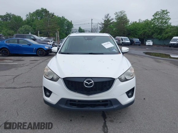 2015 Mazda CX-5 Grand Touring with VIN JM3KE4DY5F0530854, listed as a IAAI auction lot 42274582 with 144,732 mi miles and . Bid and sale history available at DreamBid. Image 12.