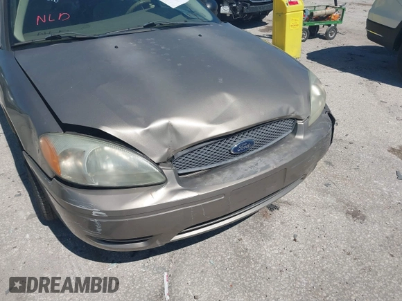 2006 Ford Taurus SE with VIN 1FAFP53U96A223924, listed as a IAAI auction lot 41828443 with 114,653 mi miles. Bid and sale history available at carsss.com. Image 13.