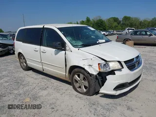 2013 Dodge Grand Caravan SE with VIN 2C4RDGBG9DR516044, listed as a IAAI auction lot 41998893 with 214,645 mi miles and . Bid and sale history available at DreamBid. Image 1.