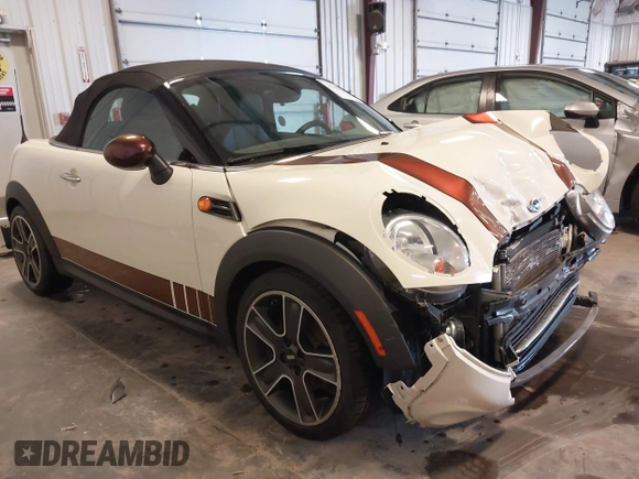 2013 MINI Roadster with VIN WMWSY1C52DT625564, listed as a IAAI auction lot 41442864 with 98,240 mi miles and . Bid and sale history available at DreamBid. Image 1.
