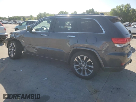 2017 Jeep Grand Cherokee Overland with VIN 1C4RJFCG9HC601806, listed as a Copart auction lot 61786275 with 122,898 mi miles and Salvage title. Bid and sale history available at DreamBid. Image 2.