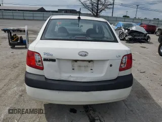2009 Kia Rio LX with VIN KNADE223996526222, listed as a Copart auction lot 69976484 with 318,702 mi miles and Salvage Title. Bid and sale history available at DreamBid. Image 6.