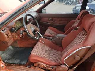 1983 Toyota Supra z VIN JT2MA67L9D0056034, wystawiony jako Copart lot #82382484 z przebiegiem 39 338 mil mil oraz Szkoda całkowita • Salvage title. Historia ofert i sprzedaży dostępna na DreamBid. Obrazek 7.