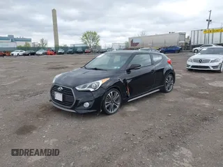 2016 Hyundai Veloster Turbo with VIN KMHTC6AE1GU264151, listed as a IAAI auction lot 42054383 with 92,378 mi miles. Bid and sale history available at carsss.com. Image 2.