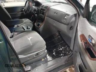 2003 Kia Sedona LX with VIN KNDUP131336390410, listed as a IAAI auction lot 41602426 with 170,613 mi miles. Bid and sale history available at carsss.com. Image 5.