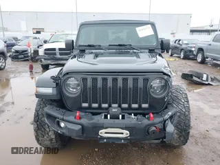 2019 Jeep Wrangler Unlimited Rubicon z VIN 1C4HJXFNXKW511193, wystawiony jako IAAI lot #41452579 z przebiegiem 91 857 mil mil oraz . Historia ofert i sprzedaży dostępna na DreamBid. Obrazek 13.