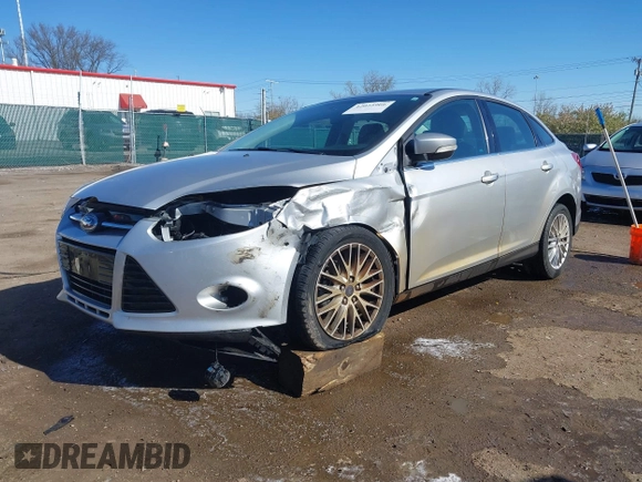 2014 Ford Focus Titanium with VIN 1FADP3J28EL354505, listed as a IAAI auction lot 42025966 with 104,868 mi miles. Bid and sale history available at carsss.com. Image 2.