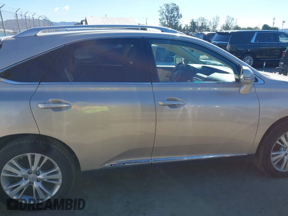 2011 Lexus RX 450h with VIN JTJBC1BAXB2420753, listed as a IAAI auction lot 41823358 with 102,714 mi miles and . Bid and sale history available at DreamBid. Image 13.