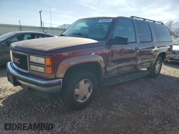 1997 GMC Suburban z VIN 1GKFK16R0VJ739603, wystawiony jako Copart lot #48430045 z przebiegiem 195 017 mil mil oraz Szkoda całkowita • Salvage title. Historia ofert i sprzedaży dostępna na DreamBid. Obrazek 1.