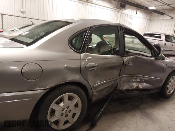2006 Ford Taurus SE with VIN 1FAFP53U86A113947, listed as a IAAI auction lot 41753927 with 203,867 mi miles. Bid and sale history available at carsss.com. Image 6.