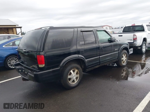 1999 Oldsmobile Bravada z VIN 1GHDT13W0X2712225, wystawiony jako IAAI lot #41550117 z przebiegiem 170 706 mil mil oraz . Historia ofert i sprzedaży dostępna na DreamBid. Obrazek 4.