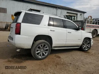 2015 Chevrolet Tahoe LTZ with VIN 1GNSKCKC1FR310018, listed as a Copart auction lot 71798454 with 244,179 mi miles and Salvage title. Bid and sale history available at DreamBid. Image 3.
