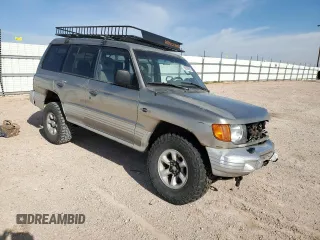 1998 Mitsubishi Montero z VIN JA4MR51R0WJ000921, wystawiony jako Copart lot #56250965 z przebiegiem 181 293 mil mil oraz Szkoda całkowita • Salvage title. Historia ofert i sprzedaży dostępna na DreamBid. Obrazek 4.