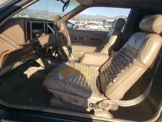 1988 Cadillac Eldorado with VIN 1G6EL1153JU612185, listed as a Copart auction lot 83786144 with 133,882 mi miles and Salvage Title. Bid and sale history available at DreamBid. Image 7.