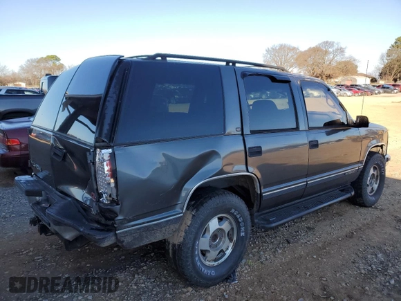 1999 GMC Yukon with VIN 1GKEK13R3XJ750307, listed as a Copart auction lot 84728104 with 212,879 mi miles and Salvage Title. Bid and sale history available at carsss.com. Image 3.