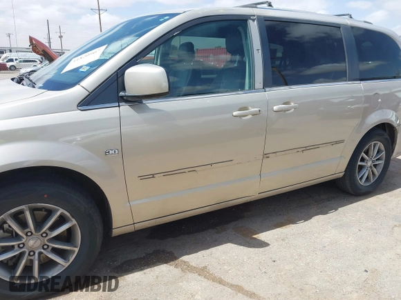 2014 Dodge Grand Caravan SXT with VIN 2C4RDGCG6ER466459, listed as a IAAI auction lot 41820907 with 105,404 mi miles and . Bid and sale history available at DreamBid. Image 6.