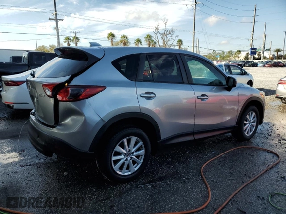 2014 Mazda CX-5 Touring with VIN JM3KE2CY8E0305641, listed as a Copart auction lot 42617165 with 107,336 mi miles and Salvage Title. Bid and sale history available at carsss.com. Image 3.