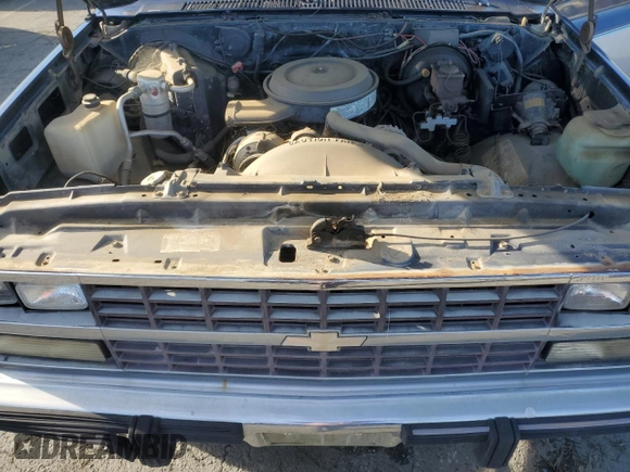 1991 Chevrolet Suburban z VIN 1GNGV26K1MF104219, wystawiony jako Copart lot #87527045 z przebiegiem 189 345 mil mil oraz Czysty tytuł • Clean title. Historia ofert i sprzedaży dostępna na DreamBid. Obrazek 12.