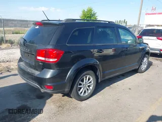 2013 Dodge Journey SXT with VIN 3C4PDDBG1DT606887, listed as a IAAI auction lot 42440507 with 250,836 mi miles and . Bid and sale history available at DreamBid. Image 4.
