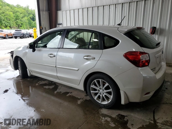 2012 Subaru Impreza Premium with VIN JF1GPAC6XCH246534, listed as a Copart auction lot 61001935 with 141,728 mi miles and Salvage title. Bid and sale history available at DreamBid. Image 2.