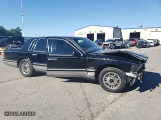 1997 Lincoln Town Car Signature with VIN 1LNLM82W0VY755395, listed as a Copart auction lot 60832324 with 143,323 mi miles and Salvage Title. Bid and sale history available at carsss.com. Image 4.