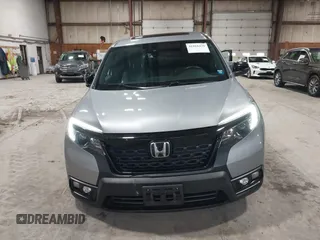 2021 Honda Passport EX-L with VIN 5FNYF8H56MB000107, listed as a IAAI auction lot 41868429 with 66,572 mi miles and . Bid and sale history available at DreamBid. Image 13.