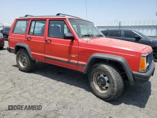 1996 Jeep Cherokee SE with VIN 1J4FT28S3TL213153, listed as a Copart auction lot 57217625 with 331,741 mi miles and Salvage title. Bid and sale history available at DreamBid. Image 4.