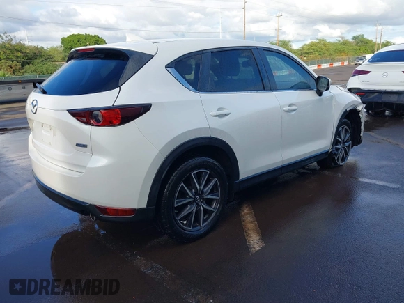 2018 Mazda CX-5 Touring with VIN JM3KFACM1J1431462, listed as a IAAI auction lot 41038099 with 77,489 mi miles. Bid and sale history available at carsss.com. Image 4.