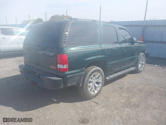 2004 GMC Yukon Denali with VIN 1GKEK63U24J265167, listed as a IAAI auction lot 41877785 with 256,691 mi miles. Bid and sale history available at carsss.com. Image 4.