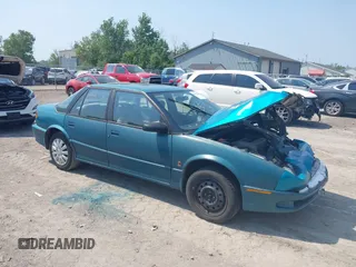 1994 Saturn SL z VIN 1G8ZJ557XRZ136761, wystawiony jako IAAI lot #42476500 z przebiegiem 200 187 mil mil oraz . Historia ofert i sprzedaży dostępna na DreamBid. Obrazek 1.