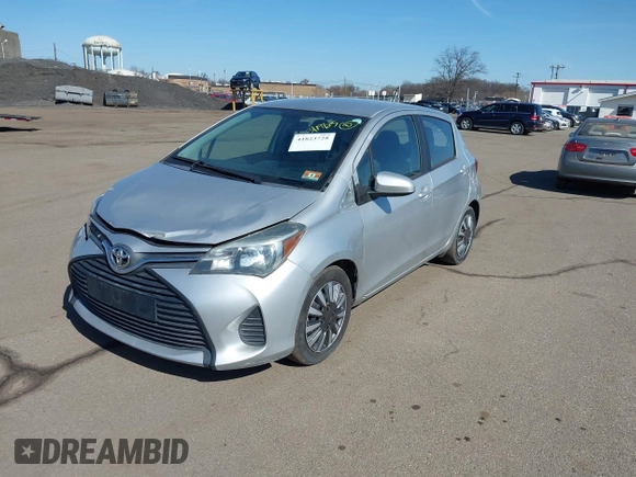 2015 Toyota Yaris L with VIN VNKKTUD38FA048576, listed as a IAAI auction lot 41823728 with 147,476 mi miles. Bid and sale history available at carsss.com. Image 2.