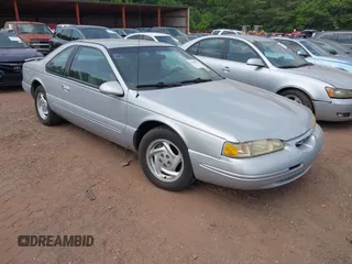 1997 Ford Thunderbird LX z VIN 1FALP62W9VH138535, wystawiony jako IAAI lot #42408021 z przebiegiem 100 711 mil mil oraz . Historia ofert i sprzedaży dostępna na DreamBid. Obrazek 1.