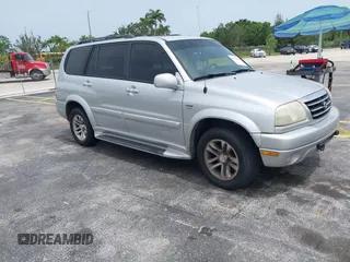 2003 Suzuki XL7 Touring z VIN JS3TX92V434114930, wystawiony jako IAAI lot #42414005 z przebiegiem 148 945 mil mil oraz . Historia ofert i sprzedaży dostępna na DreamBid. Obrazek 1.