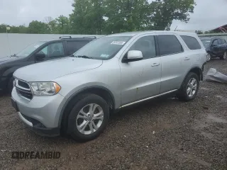 2012 Dodge Durango SXT with VIN 1C4RDJAG4CC106273, listed as a Copart auction lot 59767205 with 223,098 mi miles and Salvage title. Bid and sale history available at DreamBid. Image 1.
