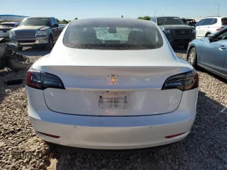 2020 Tesla Model 3 Standard Range Plus with VIN 5YJ3E1EA4LF799597, listed as a Copart auction lot 76401374 with 77,506 mi miles and Salvage Title. Bid and sale history available at DreamBid. Image 6.