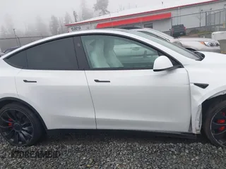 2023 Tesla Model Y Performance z VIN 7SAYGDEF2PF917295, wystawiony jako IAAI lot #41260852 z przebiegiem 23 295 mil mil oraz . Historia ofert i sprzedaży dostępna na DreamBid. Obrazek 13.