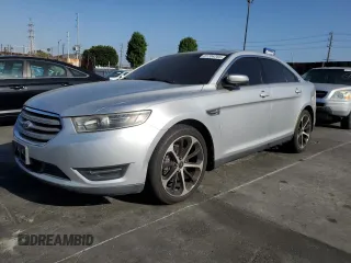 2015 Ford Taurus SEL z VIN 1FAHP2E88FG148699, wystawiony jako Copart lot #61204765 z przebiegiem 169 729 mil mil oraz Czysty tytuł • Clean title. Historia ofert i sprzedaży dostępna na DreamBid. Obrazek 1.