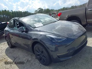 2025 Tesla Model Y Long Range with VIN 7SAYGDED3SA352138, listed as a IAAI auction lot 41760798 with 1,209 mi miles and . Bid and sale history available at DreamBid. Image 12.